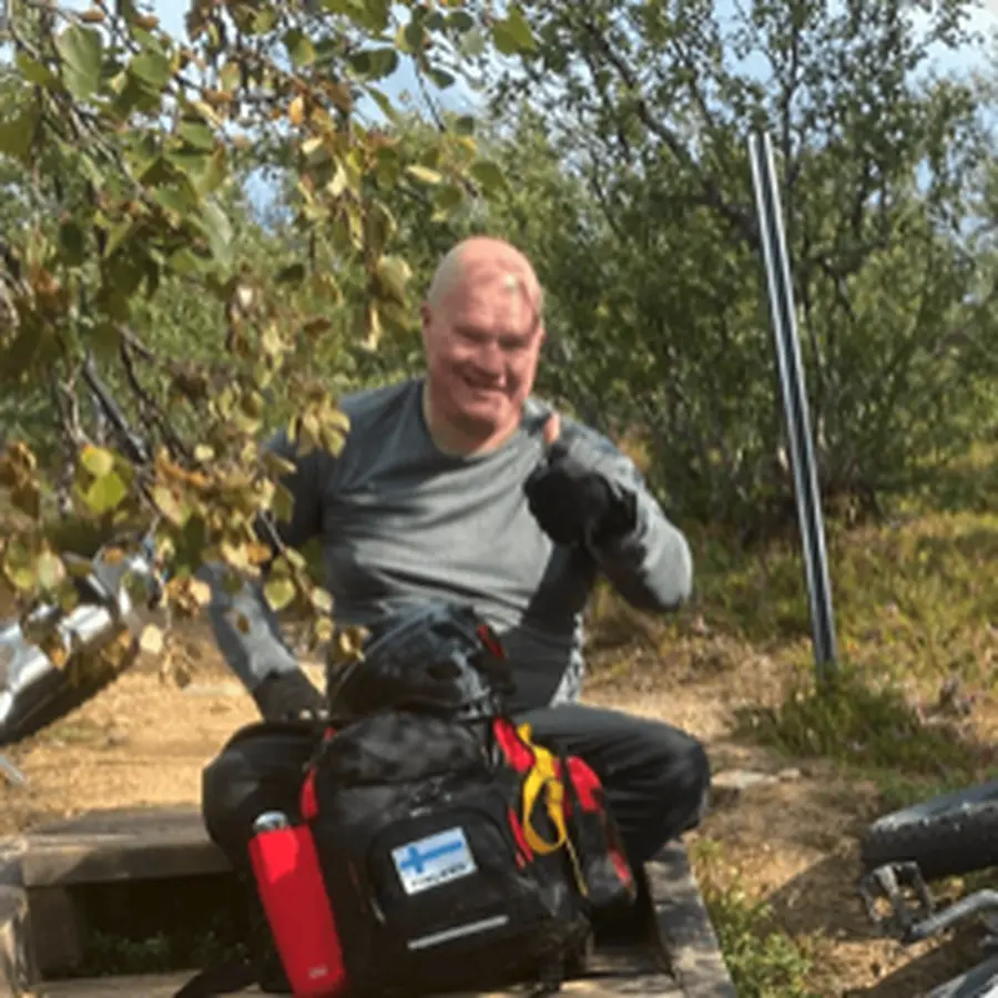 Simo Rönkkö outdoors with nature observation equipment