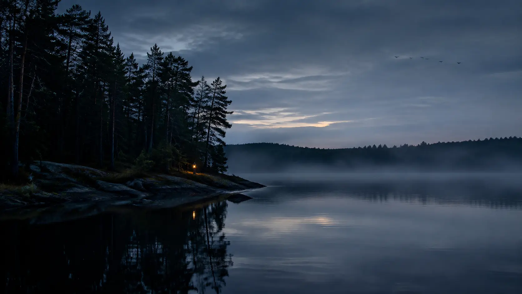 Quiet Nordic lake and forest at blue hour